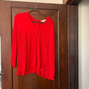 Red smocked long sleeve blouse